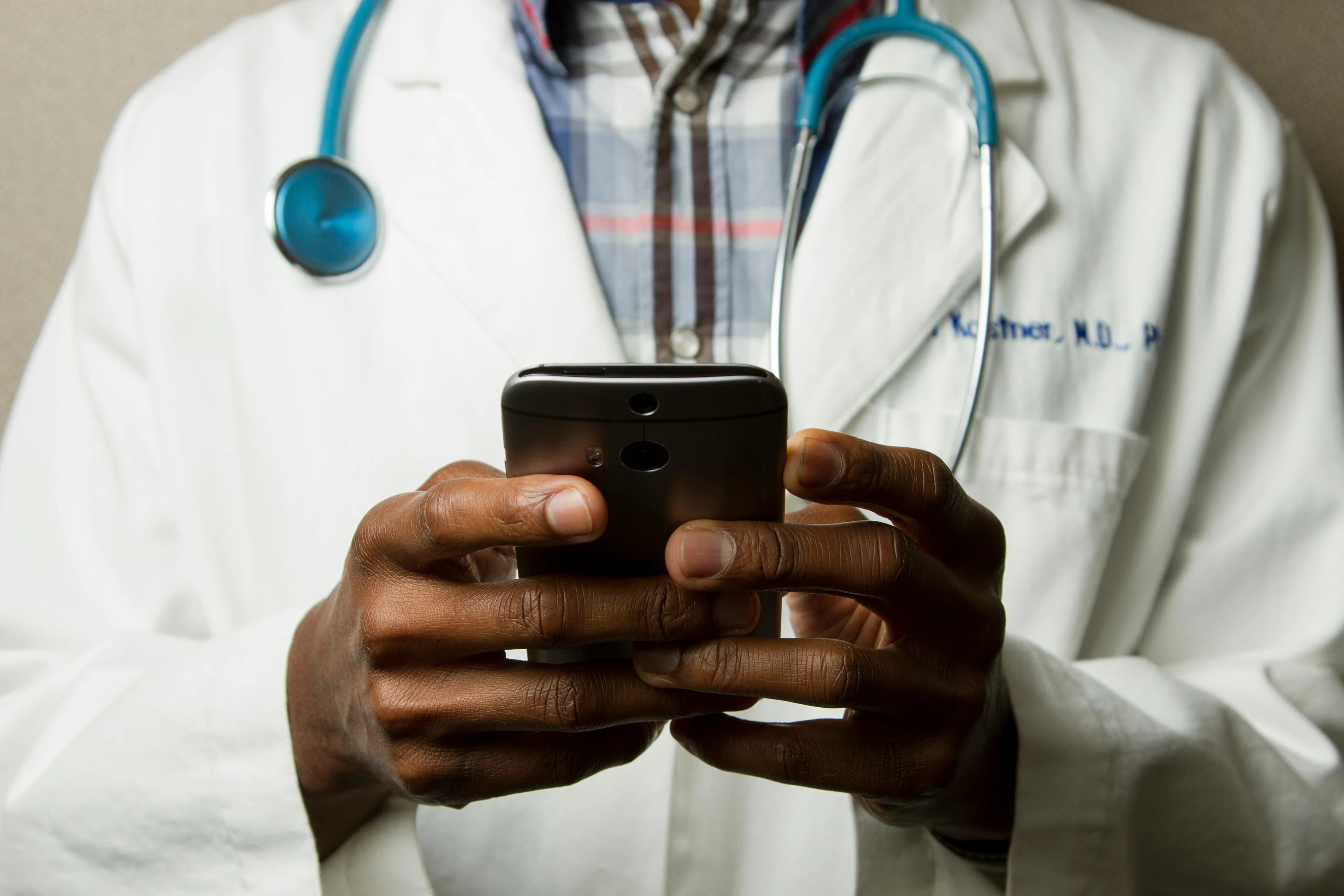 Doctor reviewing data on tablet